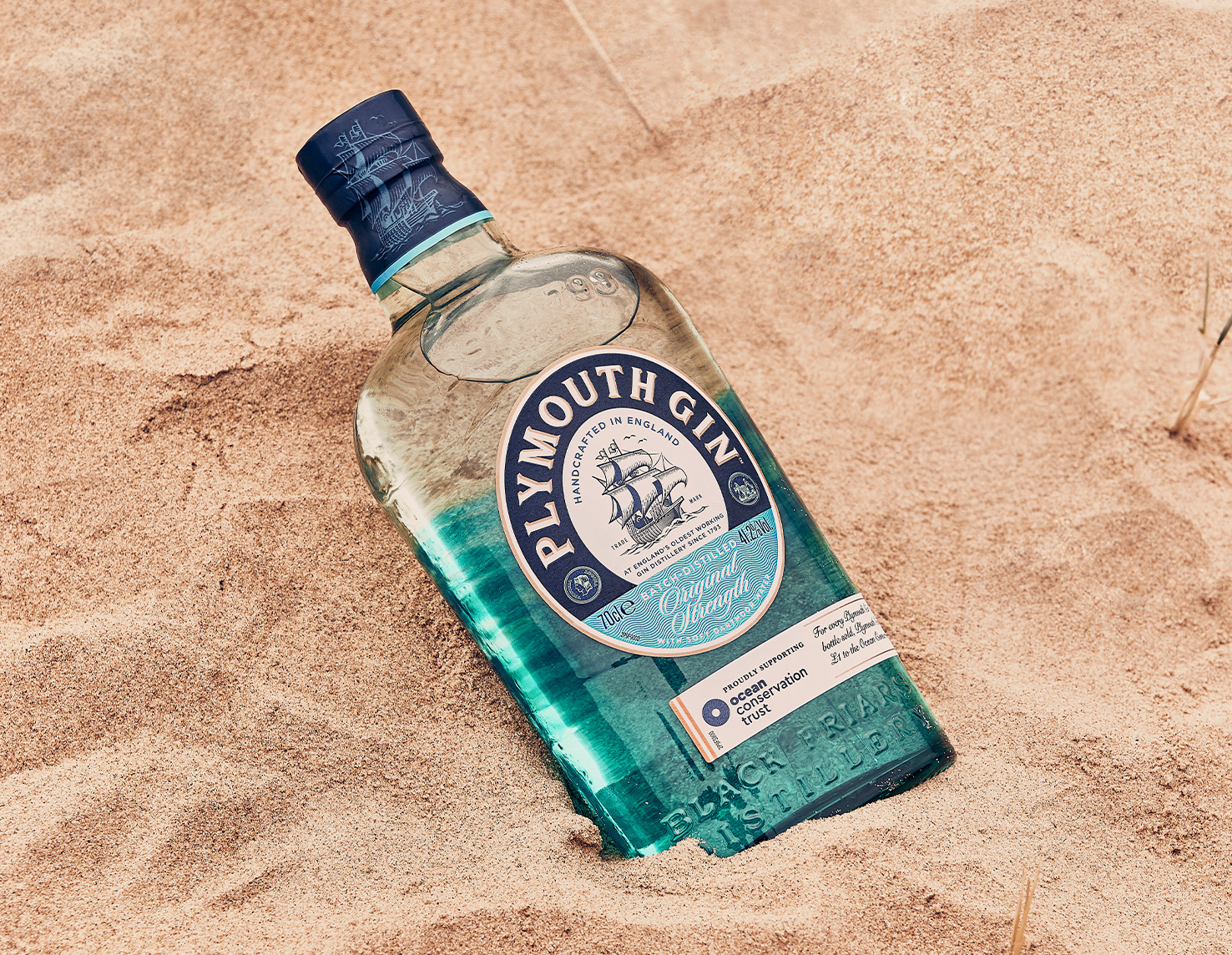 Plymouth Gin Ocean Edition in sand on the beach