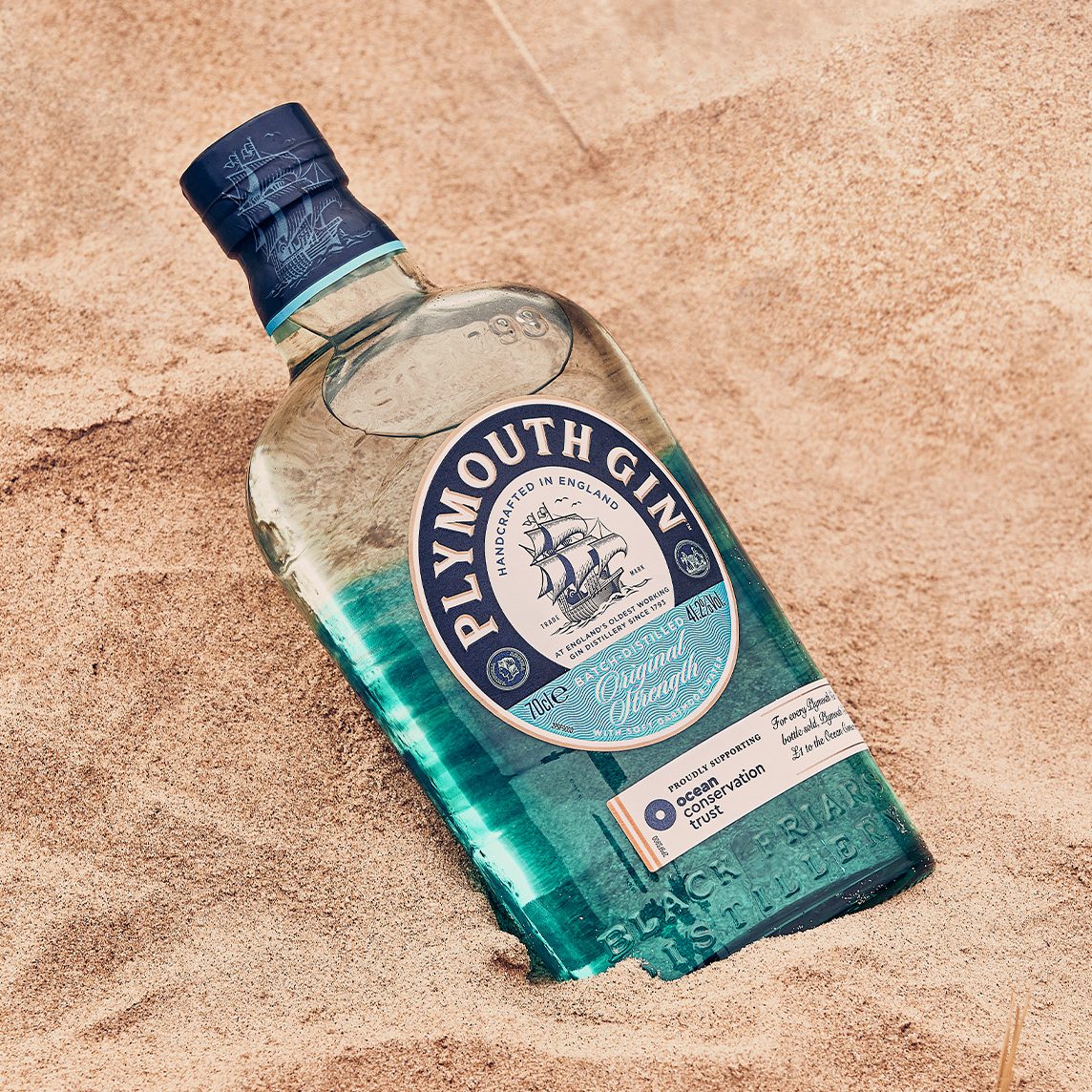 Plymouth Gin Ocean Edition in sand on the beach
